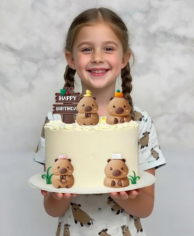 Smiling girl holding white birthday cake decorated with cute capybara cake toppers and happy birthday sign