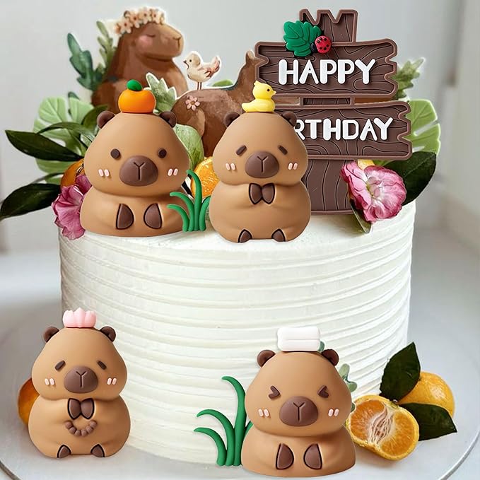 White cake decorated with four cute capybara cake toppers from MrsCapybara and colorful fruit and flowers