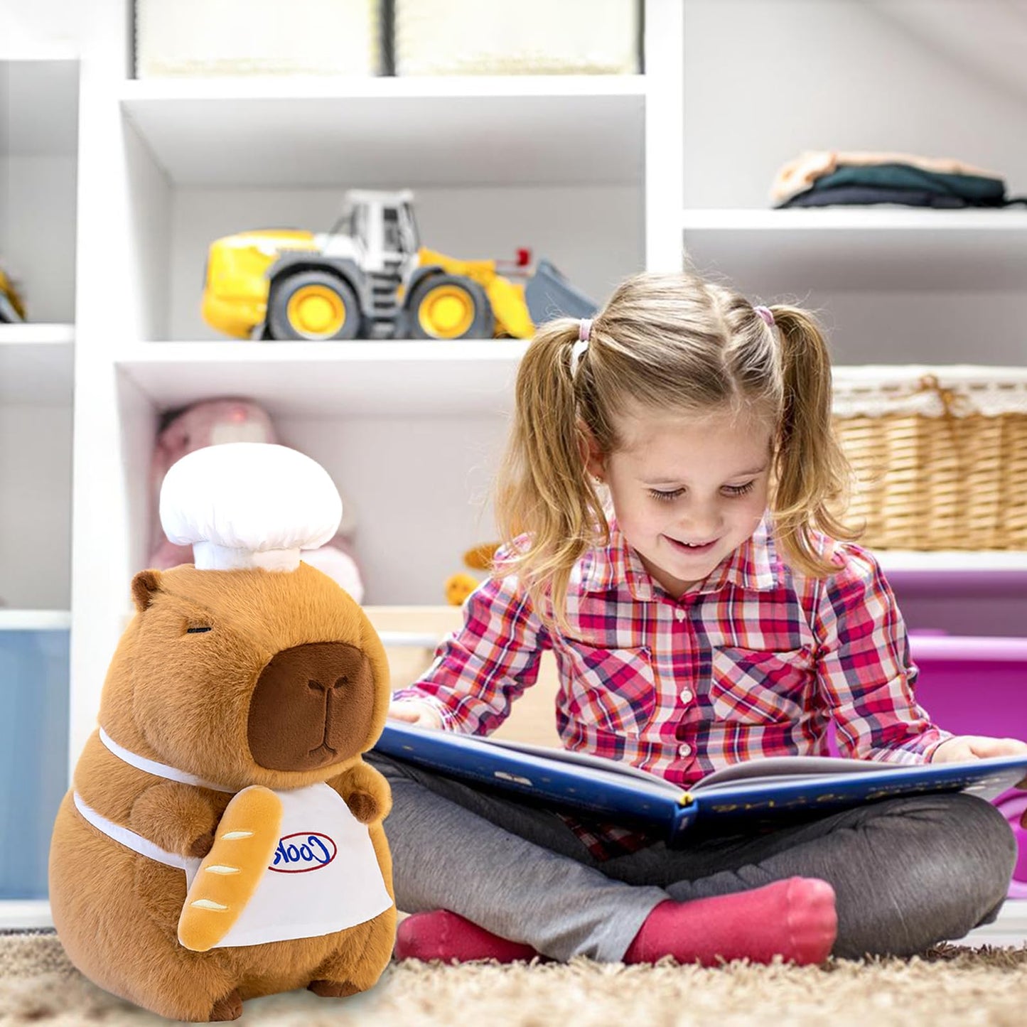 capybara chef plush toy wearing a chef hat and apron holding bread next to a smiling girl reading a book