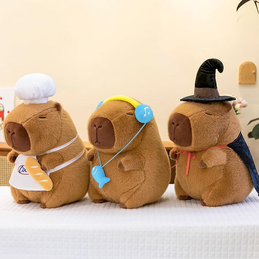 capybara chef plush wearing a white chef hat and apron holding a baguette toy