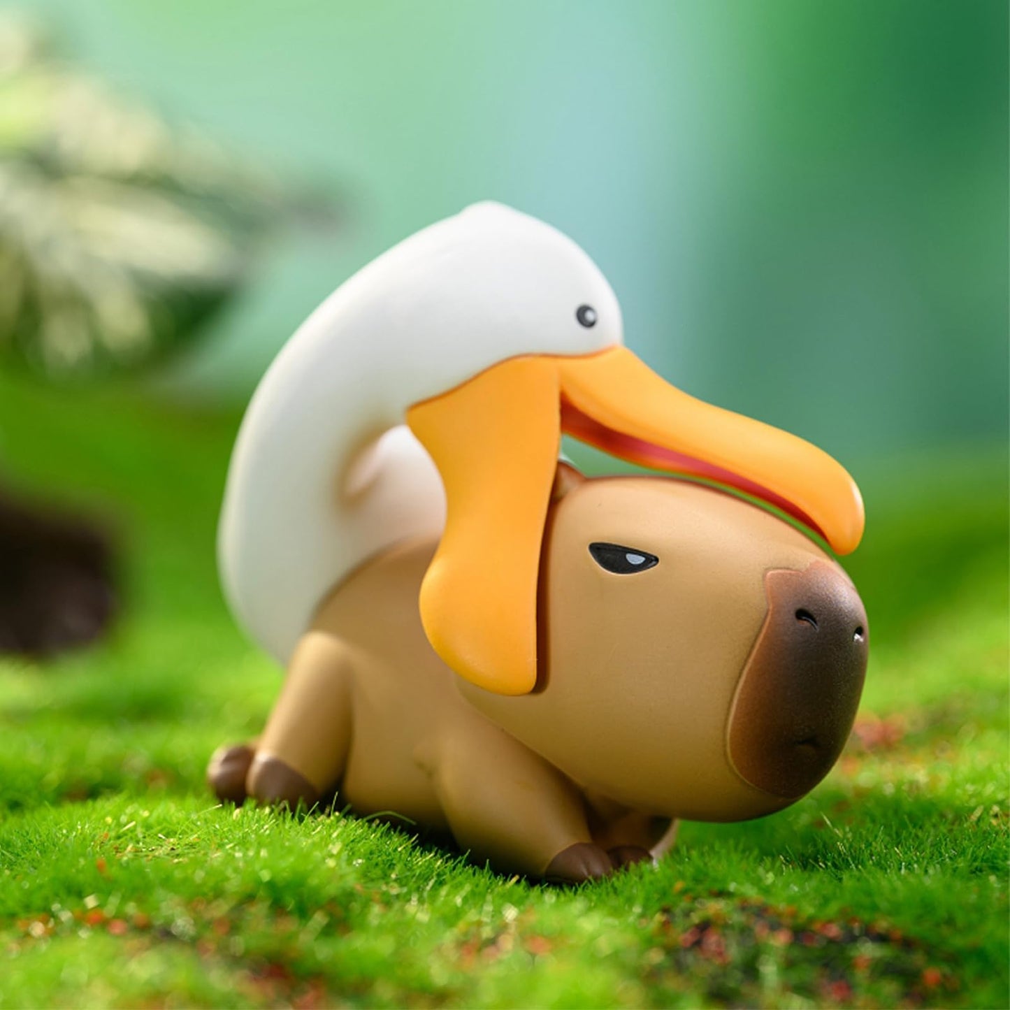 Capybara Cute Cake Toppers featuring a capybara with a white duck on its back in a grassy setting