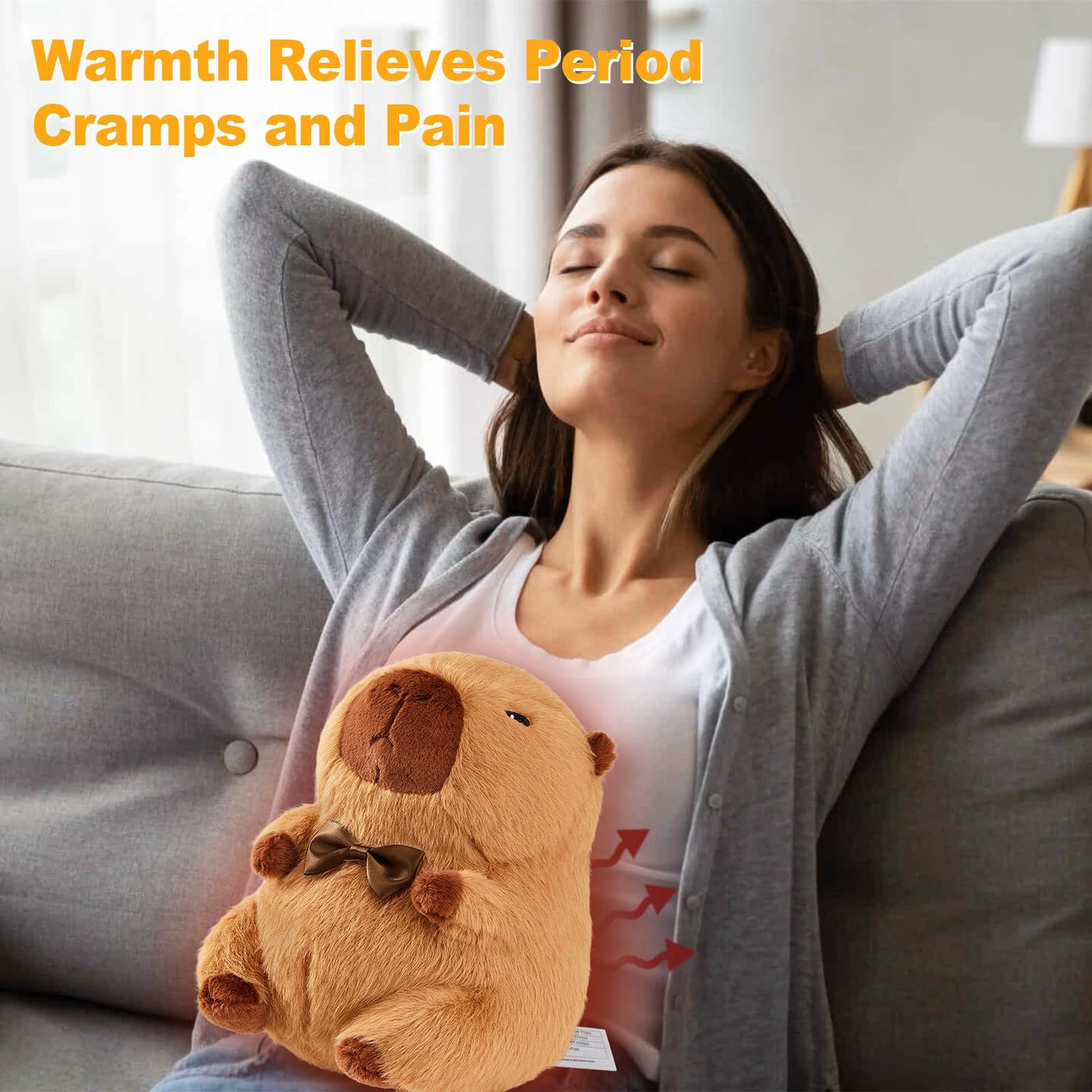 Woman relaxing on couch using capybara heating pad for cramps to relieve period pain