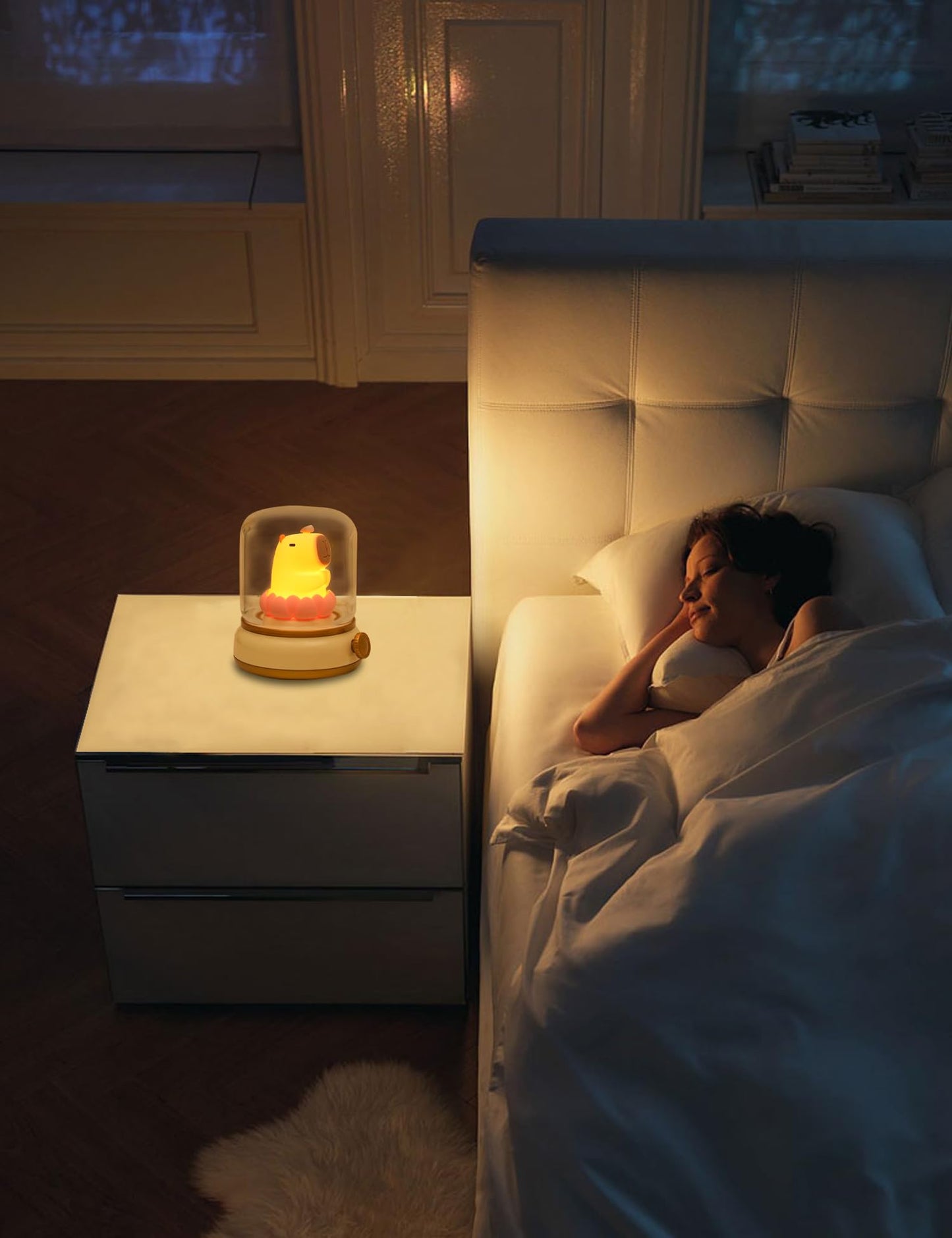 capybara night light glowing on bedroom nightstand beside sleeping woman