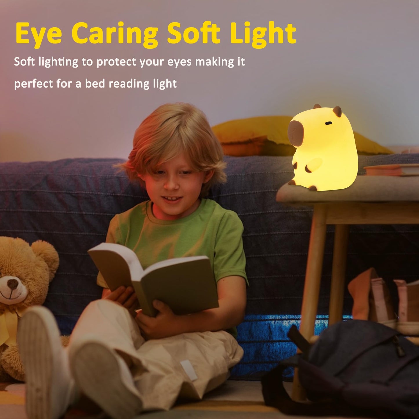 Capybara night light glowing softly on table next to child reading book in cozy room