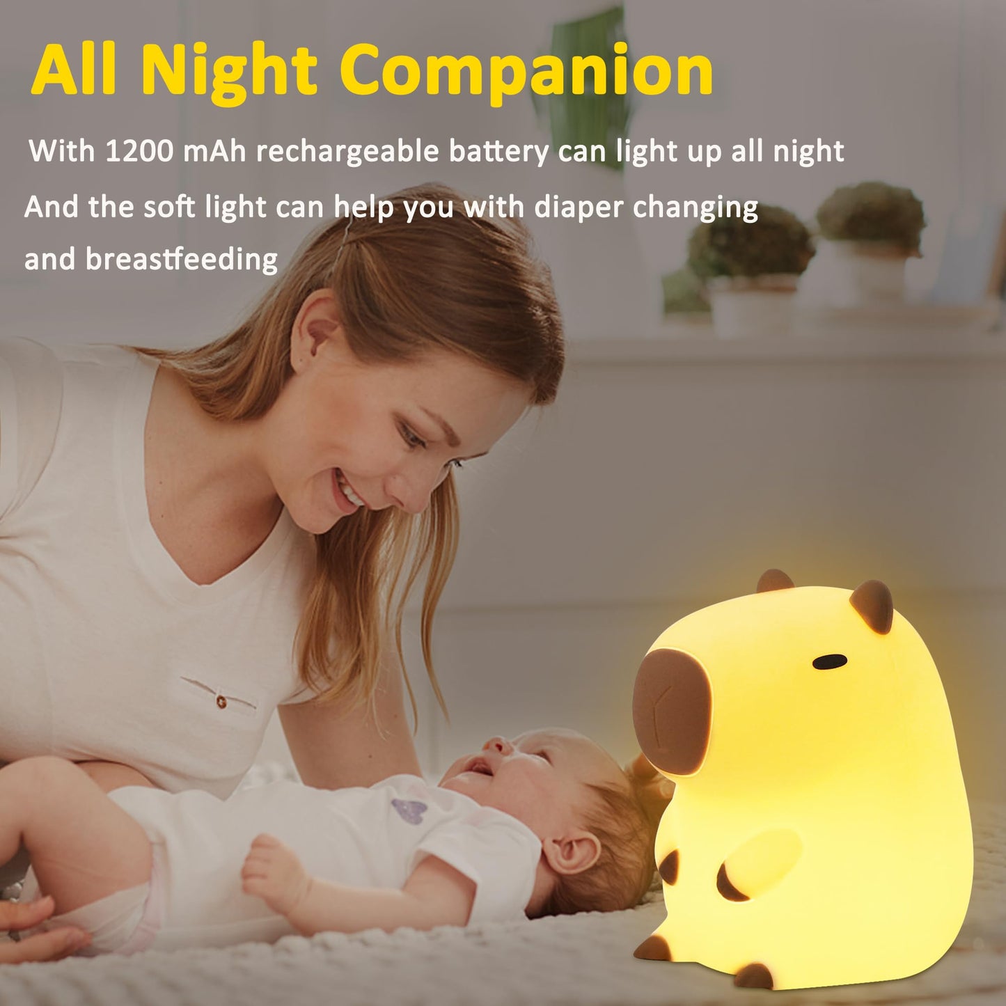 capybara night light glowing softly next to smiling mother and baby on bed