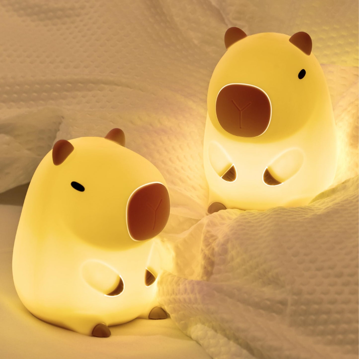 capybara night light glowing softly on a cozy bed for a soothing ambiance