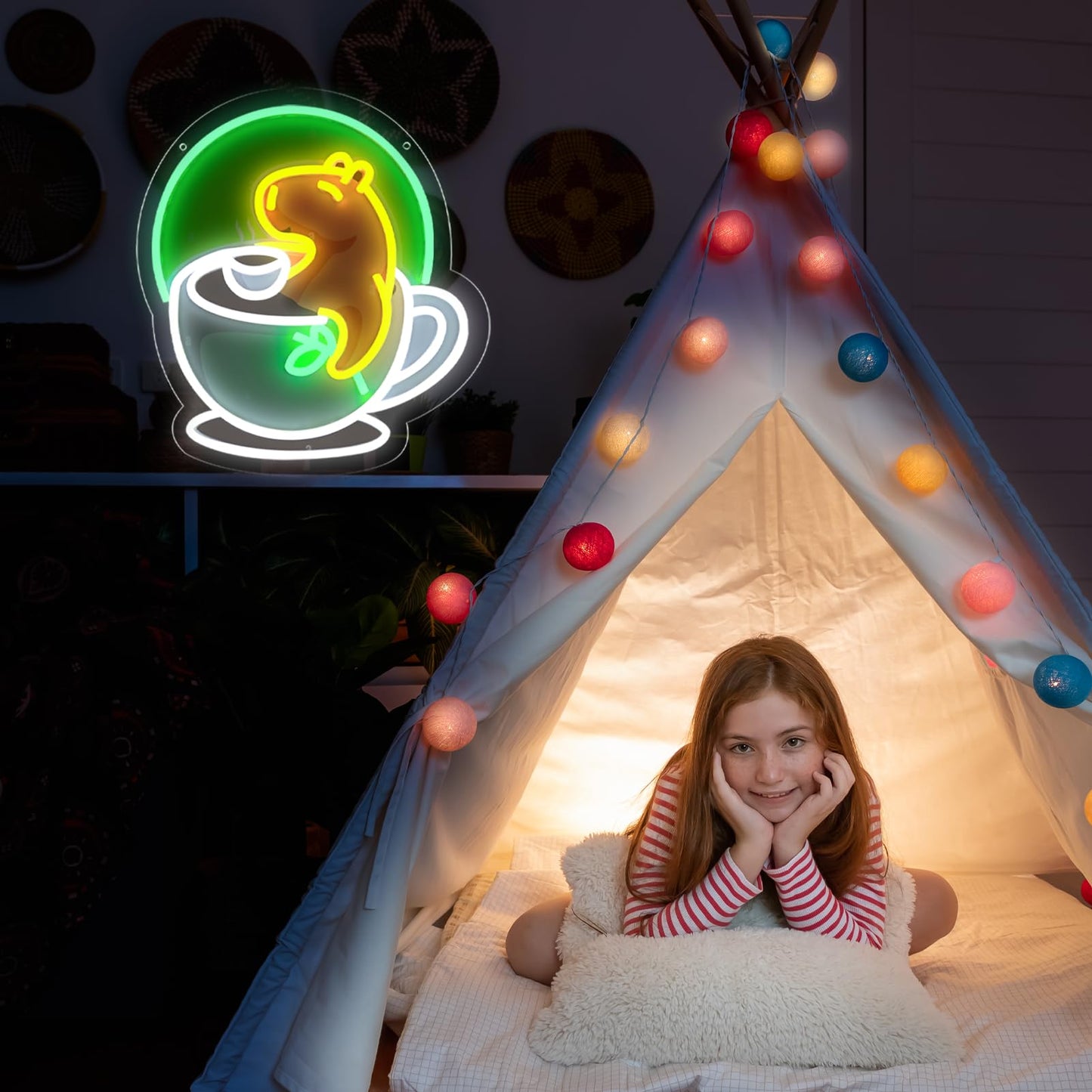 Cute animal neon wall decor of a glowing yellow bear in a coffee cup hanging near a lit teepee with a child inside