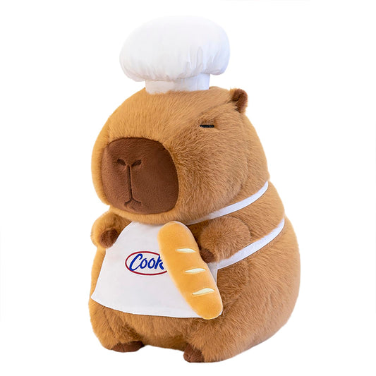 capybara chef plush wearing a white chef hat and apron holding a baguette toy