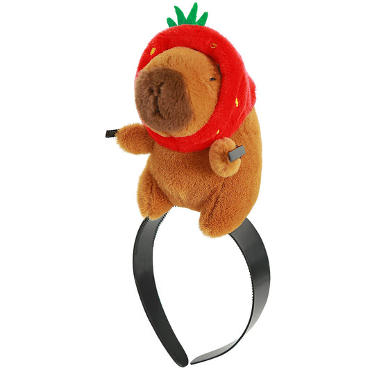 cute capybara plush wearing strawberry hat on black capybara headband accessory