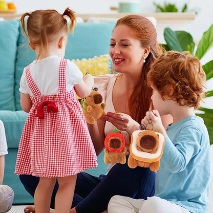 Capybara keychain set plush toys held by children and adult playing in cozy living room