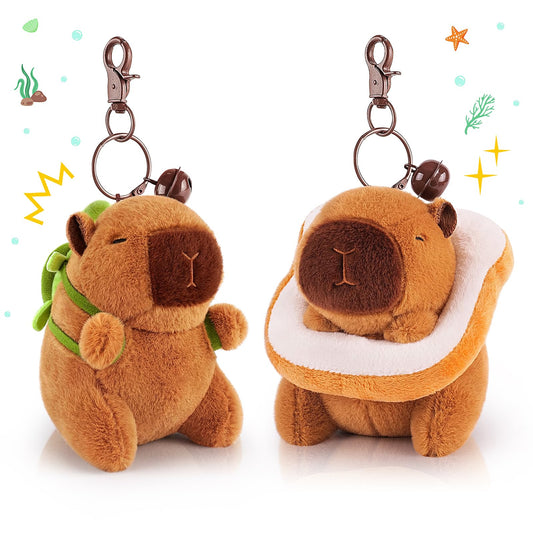 capybara keychain set with two plush brown capybaras featuring green backpack and snack design