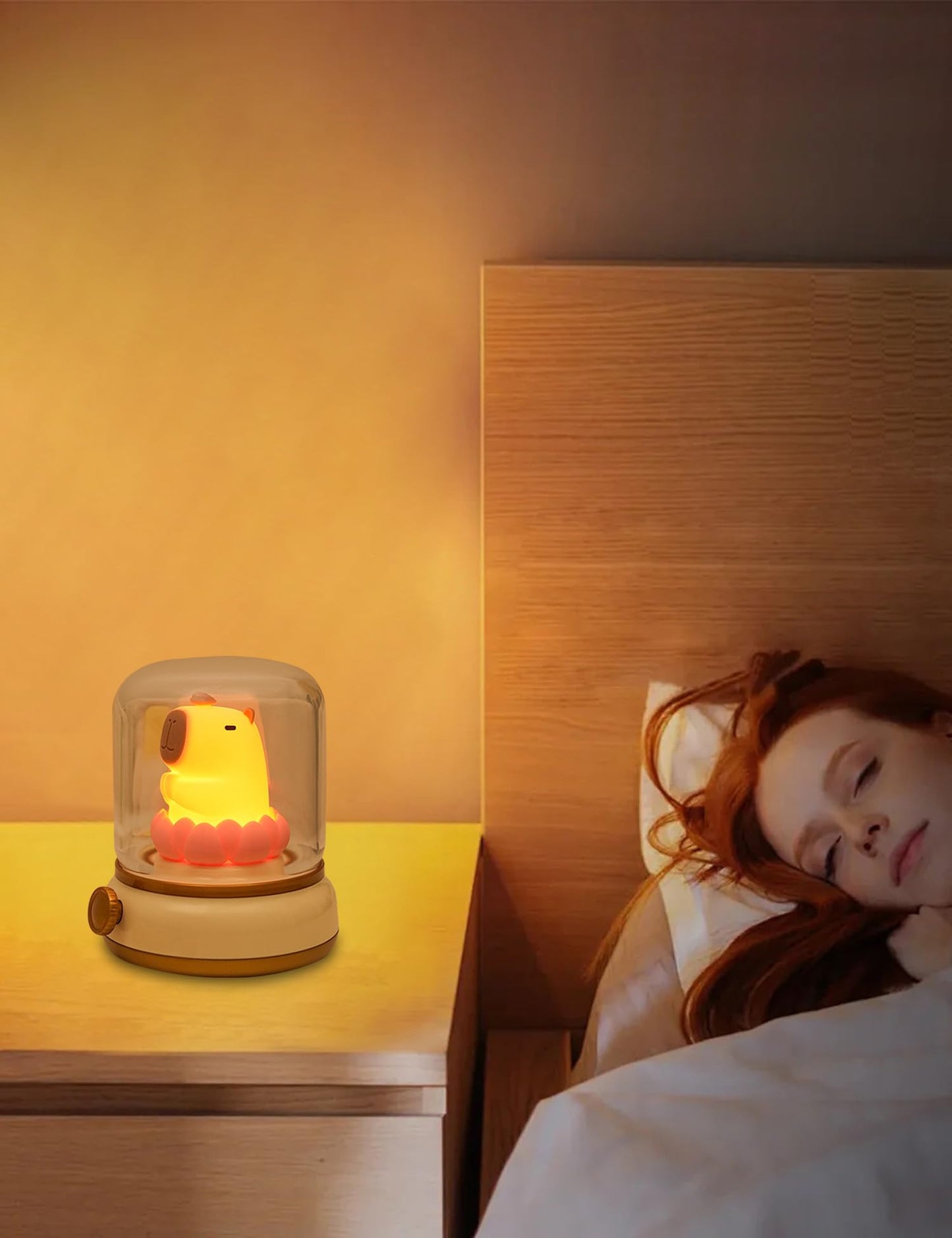 capybara night light glowing softly on bedside table next to sleeping woman