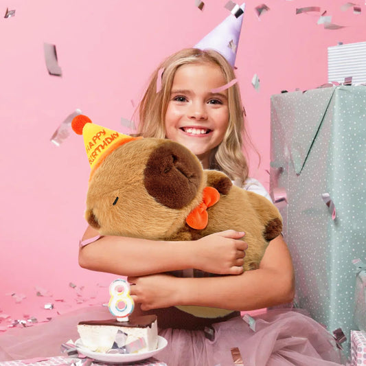 capybara pillow plush wearing a happy birthday hat and orange bow tie soft stuffed animal