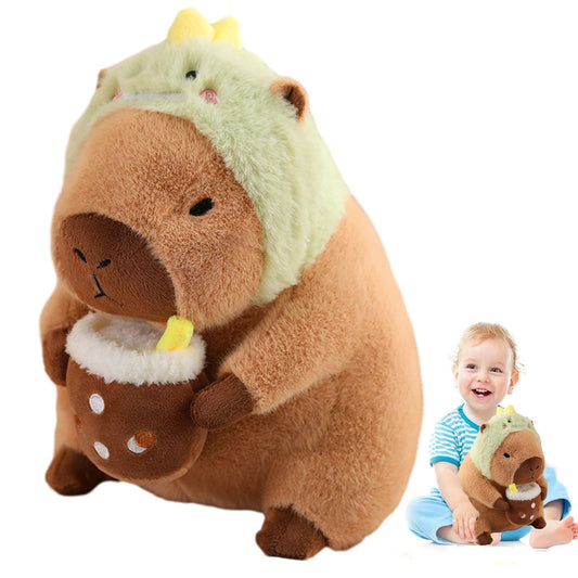 capybara plush toy with dinosaur hood holding a cup and child playing with the stuffed animal
