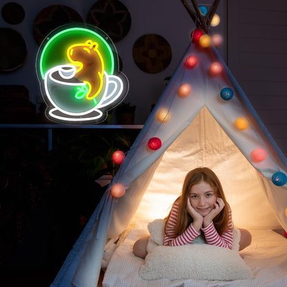 Cute animal neon wall decor of a glowing yellow bear in a coffee cup hanging near a lit teepee with a child inside