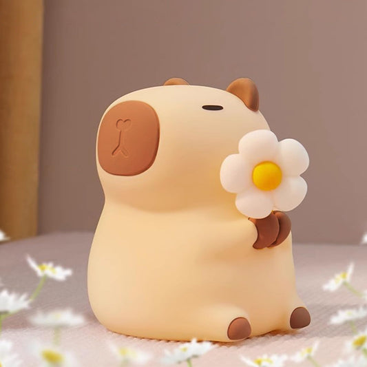 Cute animal nursery lamp shaped like a beige bear holding a white daisy flower