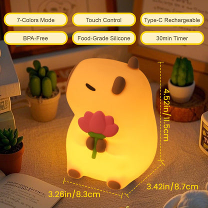 cute animal nursery lamp with touch control and 7-colors mode glowing warmly on a table
